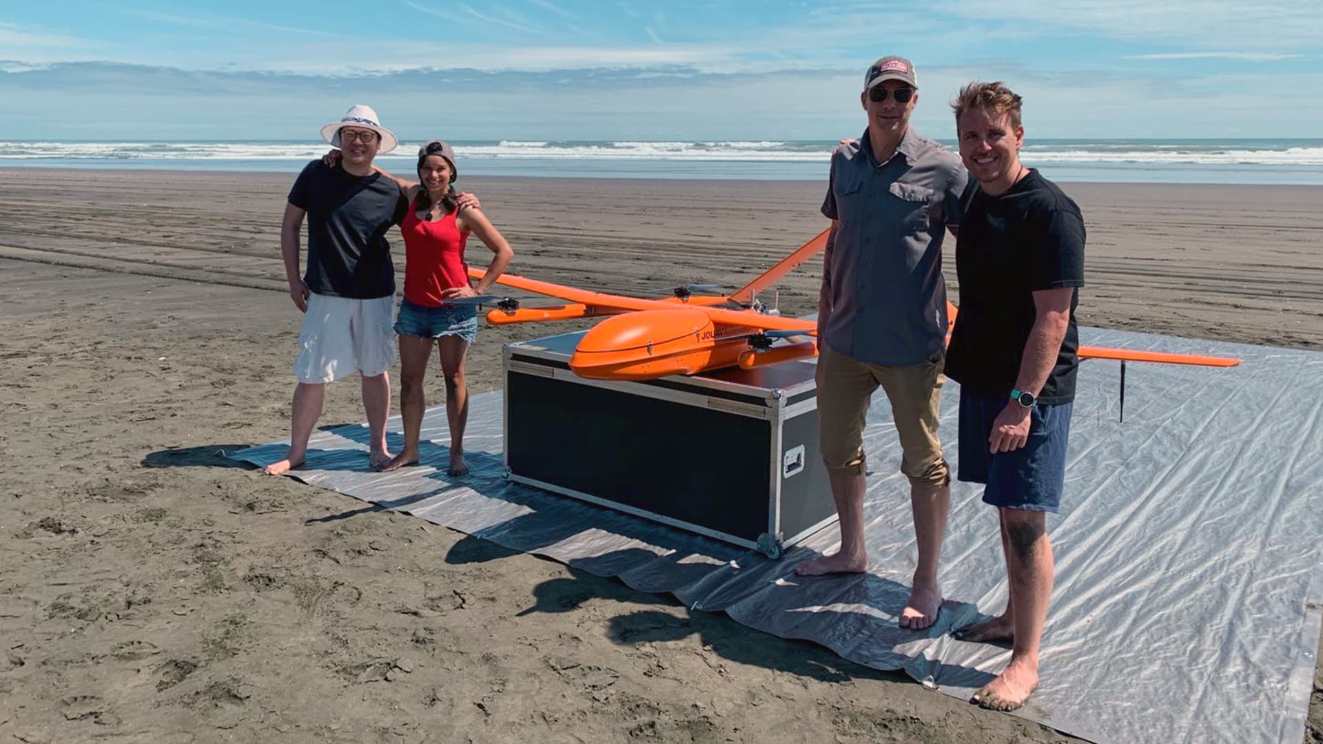 MAUI63 team pose with the drone.